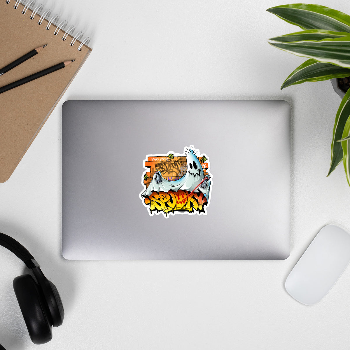 Laptop with Spooky Graffiti Sticker by Trk One from B.Different Clothing, graffiti-inspired streetwear