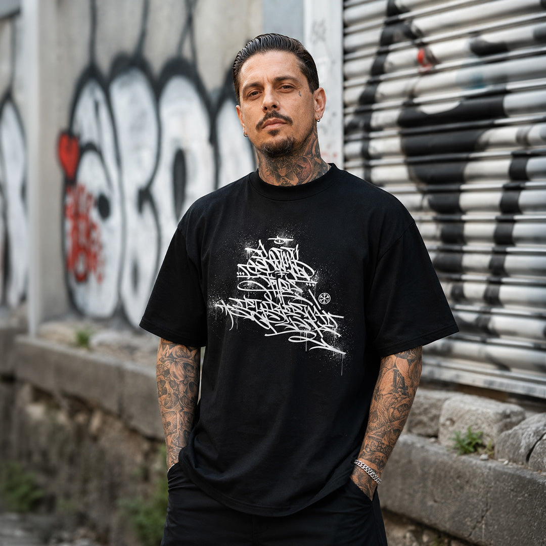 Black-Bomb The System Graffiti Tee by Shew from B.Different Clothing, male model, graffiti-inspired streetwear, oversized heavyweight t-shirt