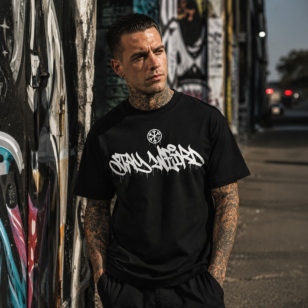Black-Stay Weird Graffiti Tag Tee by Monsterinho from B.Different Clothing, male model, graffiti-inspired streetwear, oversized heavyweight t-shirt