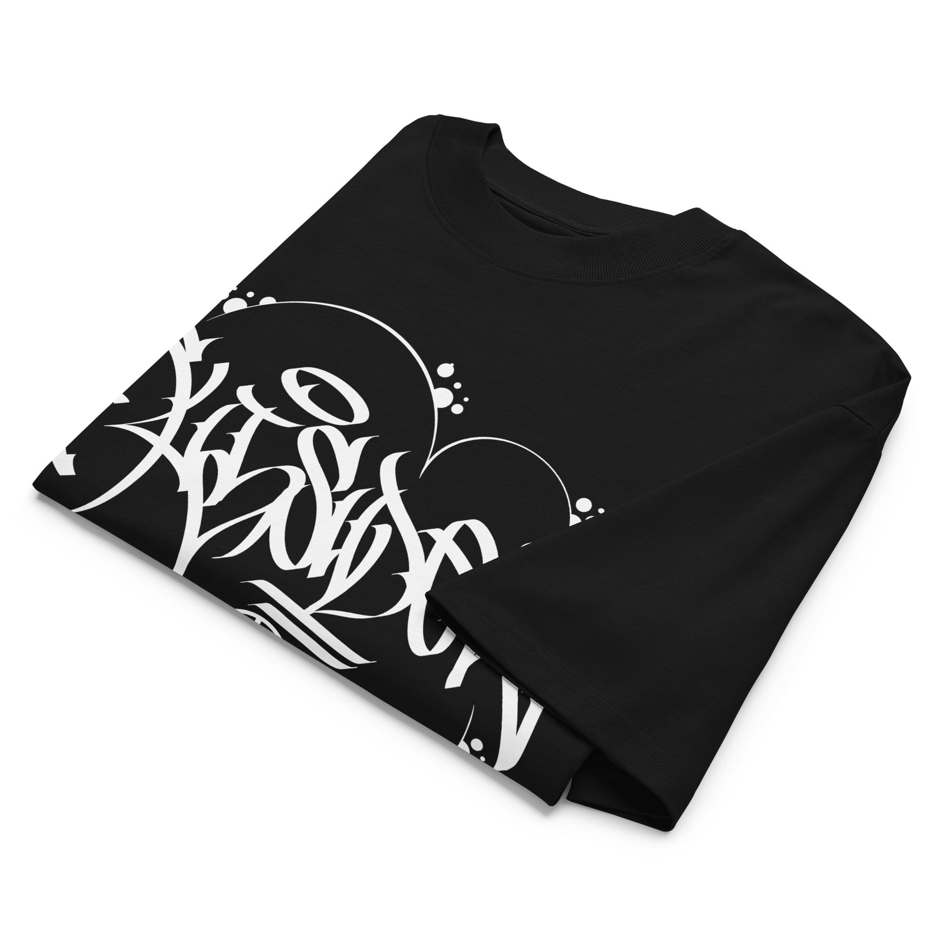 Black-Outsider Graffiti Tag Tee by Caos One from B.Different Clothing, folded, graffiti-inspired streetwear, oversized heavyweight t-shirt