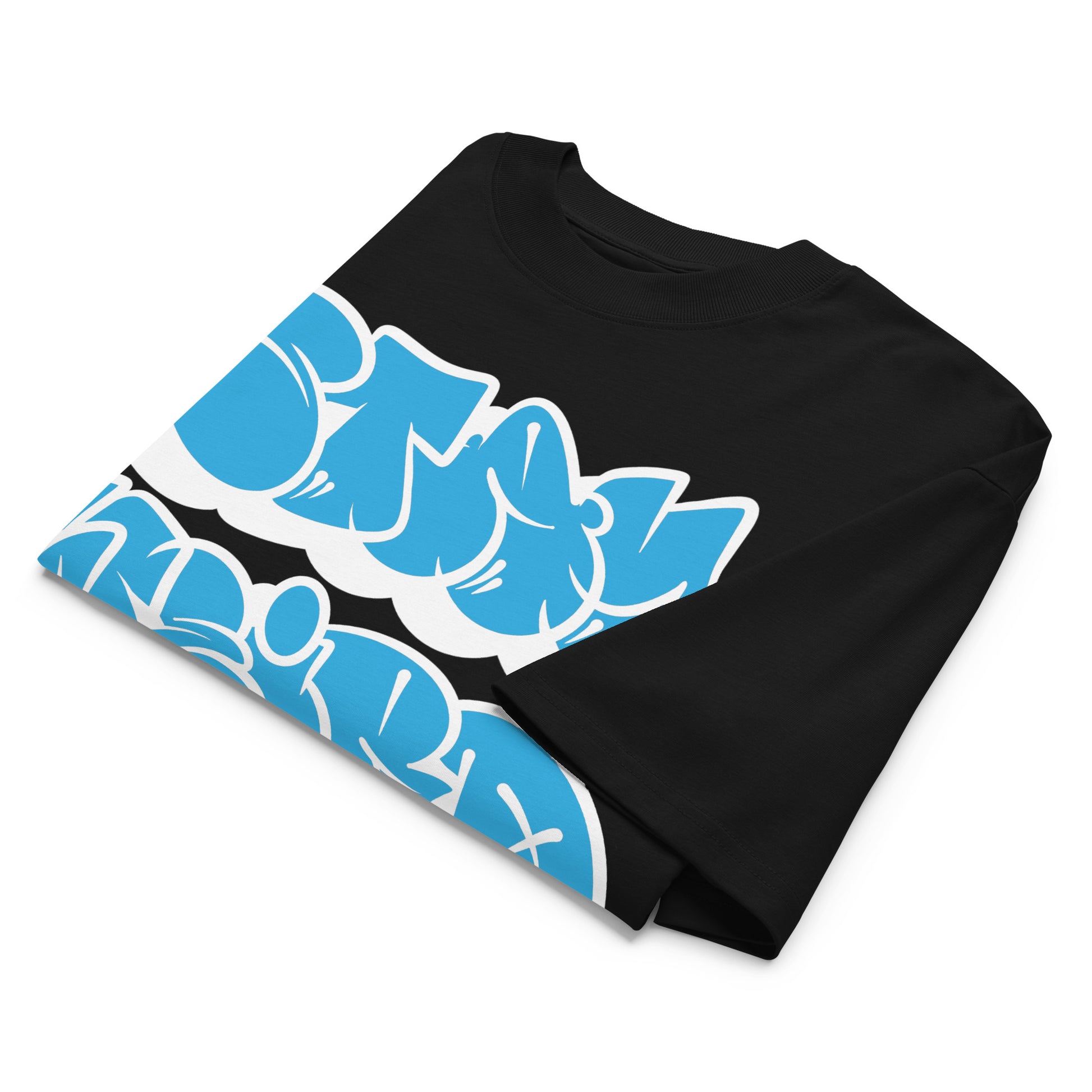 Black-Stay Weird Graffiti Throwie Tee by Monsterinho from B.Different Clothing, folded, graffiti-inspired streetwear, oversized heavyweight t-shirt