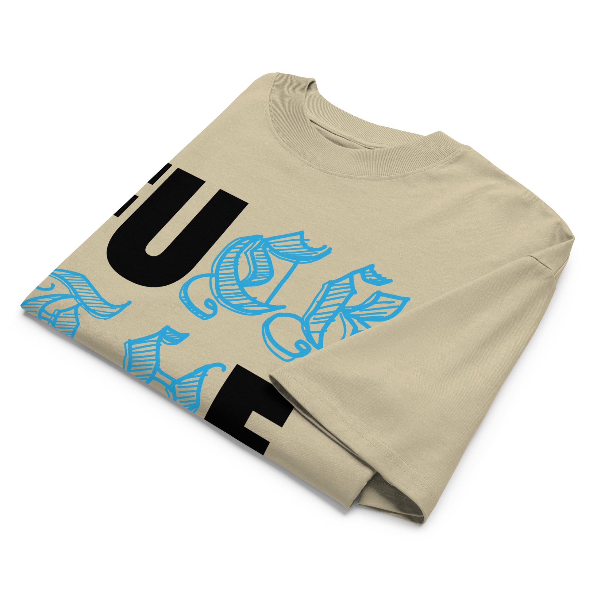 Beige-Fuck The Buff Graffiti Tee from B.Different Clothing, folded, graffiti-inspired streetwear, oversized heavyweight t-shirt