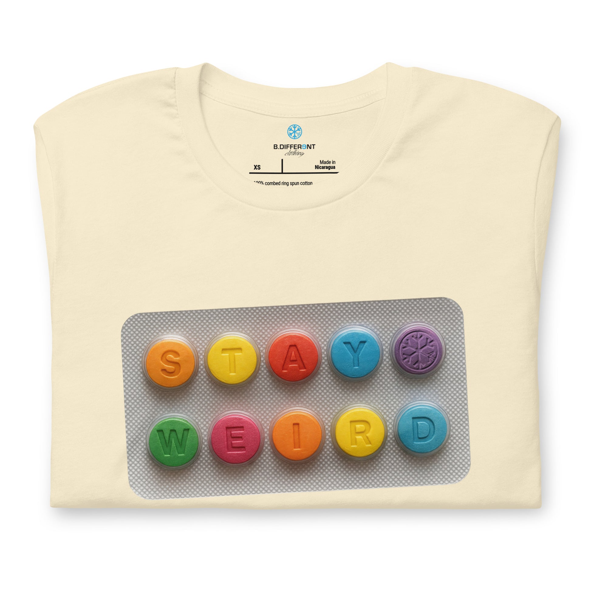 Beige-Stay Weird Pills Tee from B.Different Clothing, folded, graffiti-inspired streetwear t-shirt