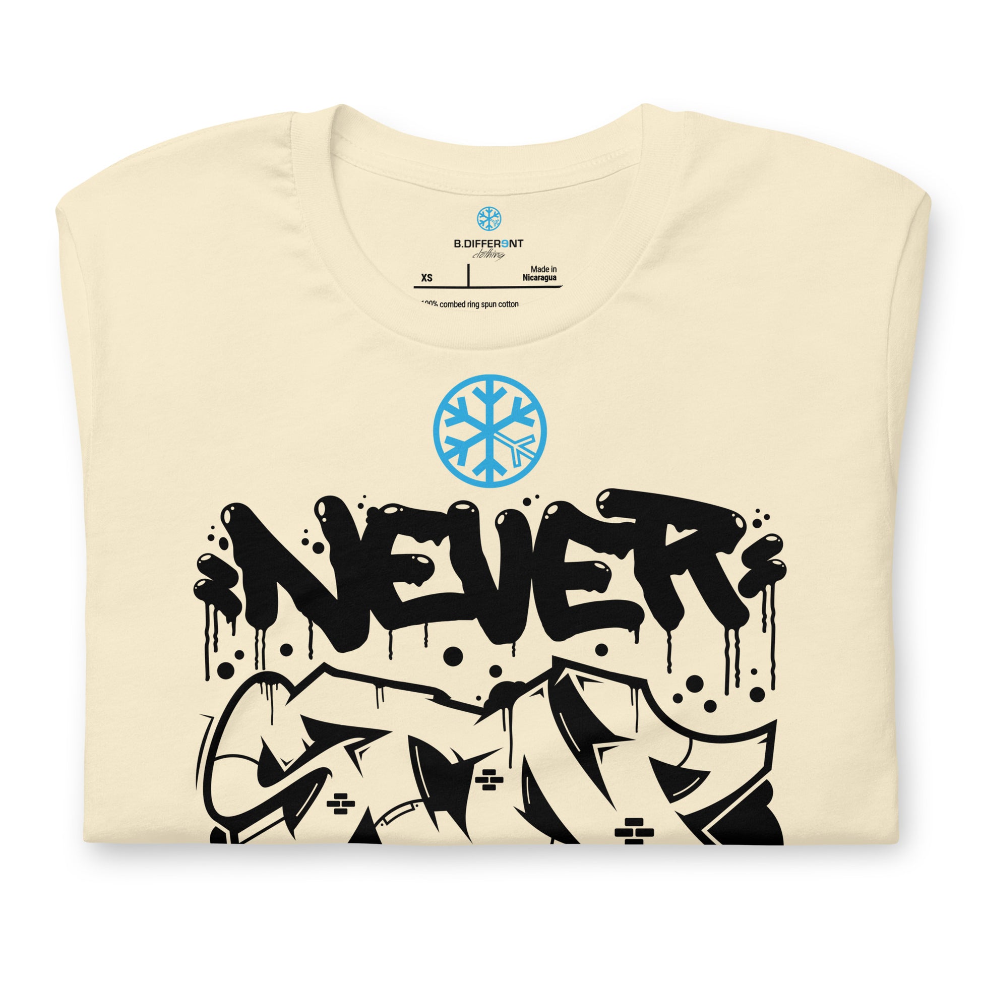 Beige-Never Stop Graffiti Piece Tee from B.Different Clothing, folded, graffiti-inspired streetwear t-shirt