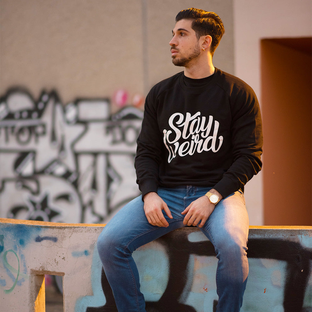 man wearing sweatshirt Stay Weird black by B.Different Clothing independent streetwear brand inspired by street art graffiti